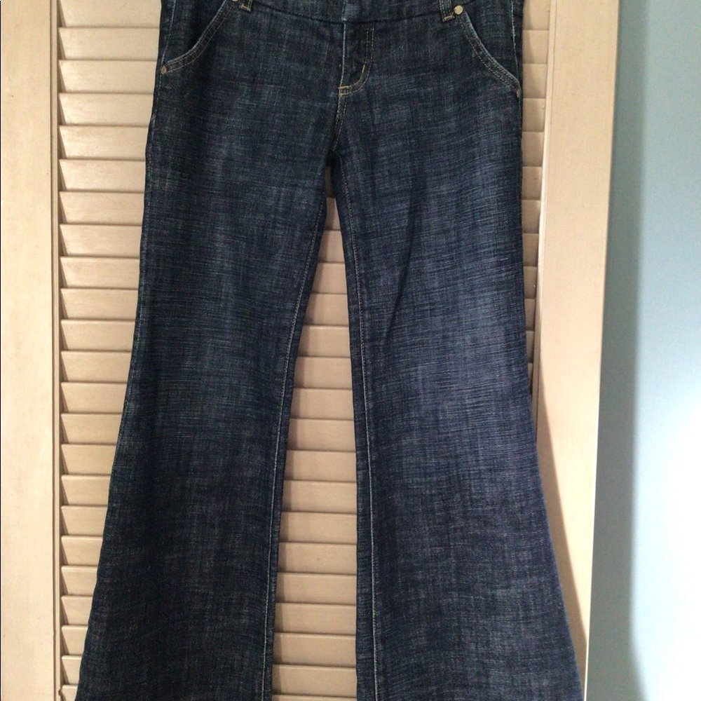 Bebe women’s jeans flared bottoms, low rise.